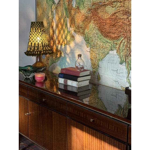 This sideboard was produced in the 1960s by Mann Mobilia, a Swiss manufacturer known for high-quality mid-century modern...