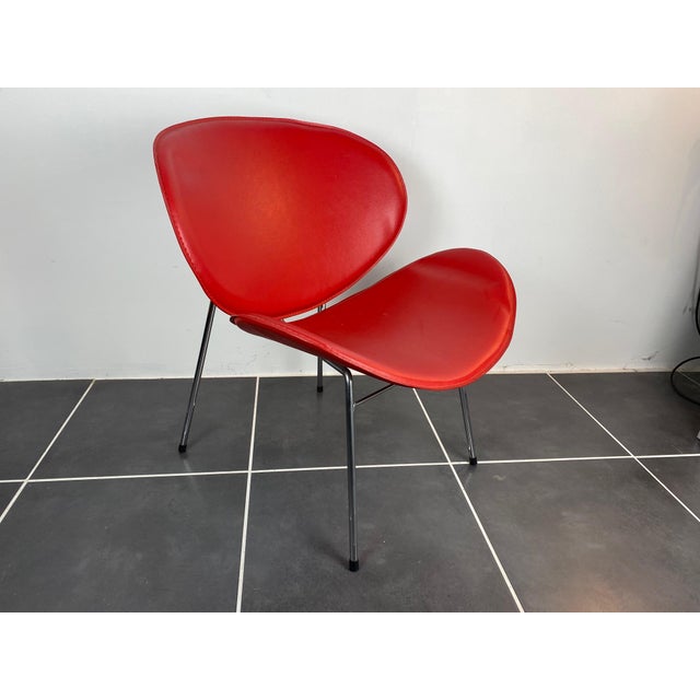 Red vinyl armchair with chrome legs 1980s Some minor imperfections and blemishes on the vinyl Height 71cm Seat height 35cm...