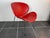 Red vinyl armchair with chrome legs 1980s Some minor imperfections and blemishes on the vinyl Height 71cm Seat height 35cm...