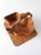 A vintage collapsible wooden basket with a warm honey tone and sculptural folding form. The layered design opens into a...