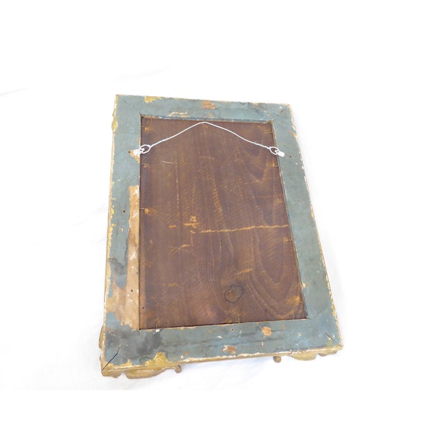 This 18th Century French carved giltwood frame with distressed mirror, measures 19"H x 14.5"W.