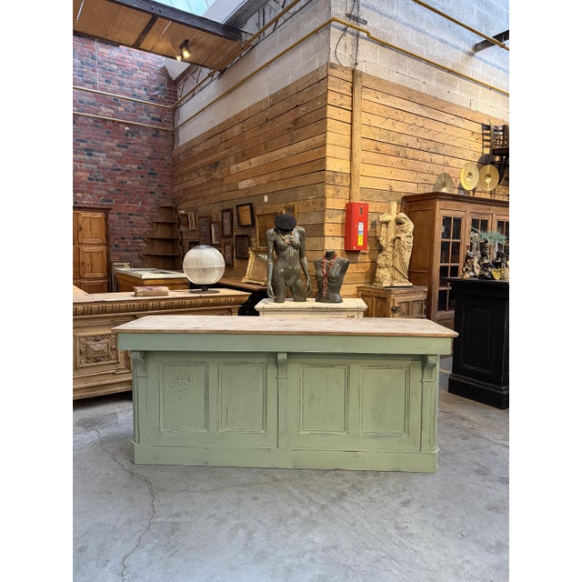 This antique, weathered sideboard has been fully restored. It features a weathered green front, a top and a body made of...