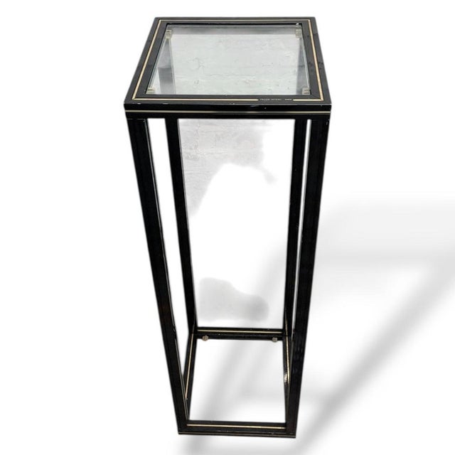 A striking vintage plant stand by renowned French designer Pierre Vandel , dating from the 1980s. Featuring a sleek black...