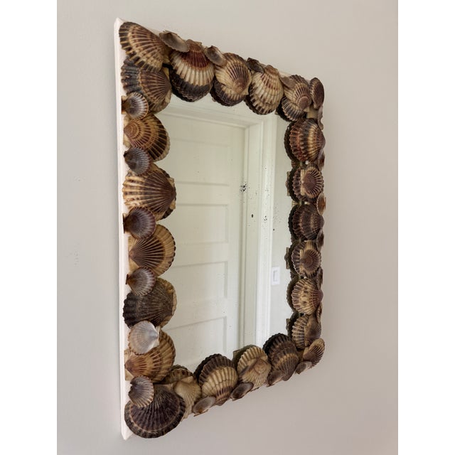 Chic and charming scallop shell mirror with the most perfect vintage patina and character. A wonderful piece for the...