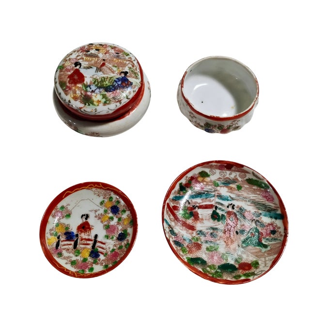 This charming 4-piece vintage Japanese porcelain se features beautifully detailed, hand-painted Geisha Girl and scenic...