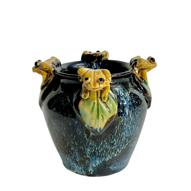 Charming vintage Italian majolica cachepot featuring four sculptural frog heads perched around the rim. Finished in a rich...