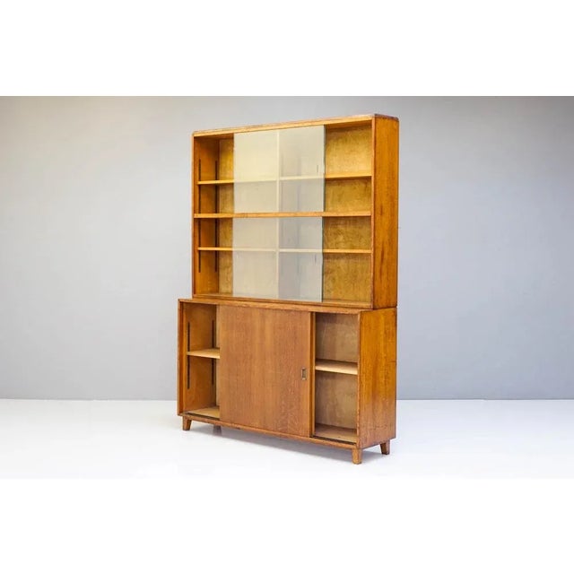 Oak cupboard and bookcase with sliding glass doors H 207cm x W 153 cm x D 40cm