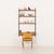 An elegant teak shelving system, designed by kai kristiansen, will create a functional and stylish working space for a...