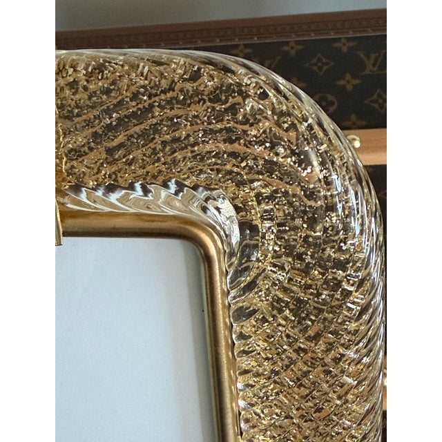 This magnificent vertical photo frame is purely in the tradition of Venetian glassmaking. The technique used to achieve...