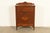 A beautiful antique Art Deco highboy dresser In the manner of Berkey & Gay USA, Circa 1930s Carved walnut, with original...