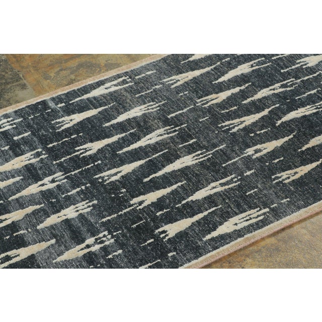 Made with hand-knotted natural silk, this 3x10 runner rug is a sophisticated addition to Rug & Kilim’s Block Print...