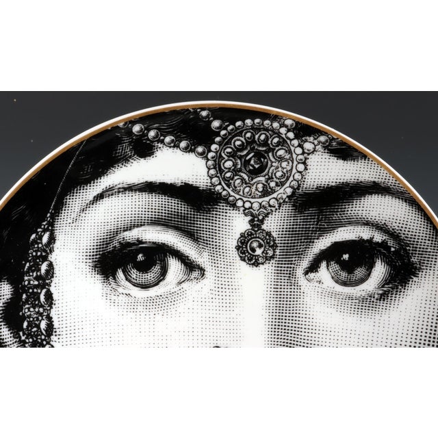 Gilded Glamour: Rosenthal Fornasetti "The Indian Beauty" Plate This striking porcelain plate, produced by Rosenthal in the...