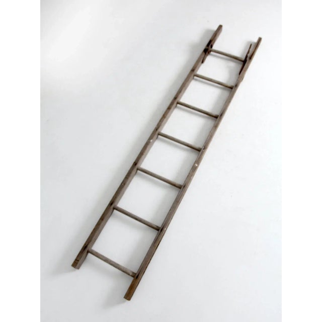 This is an antique wooden picking ladder. Makes a great blanket ladder or towel display. The rustic wooden ladder features...