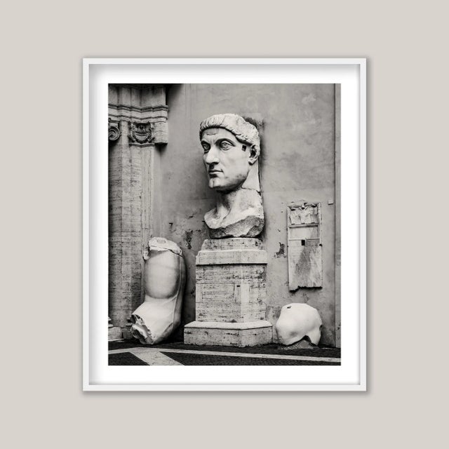 A sepia-toned black-and-white photograph of Constantine the Great, the beautiful and monumental sculpted head of the Roman...