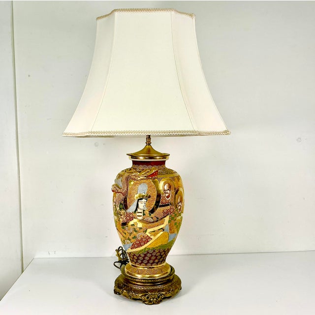 Vintage Home is pleased to present this large Japanese Satsuma hand-painted Moriage Porcelain Table Lamp. The technique of...