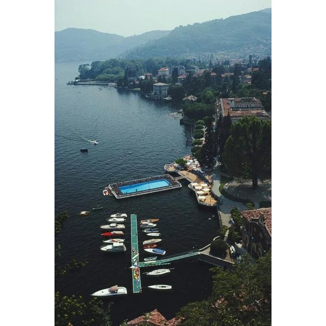 Hotel On Lake Como 1983 by Slim Aarons Slim Aarons Limited Estate Edition The swimming pool and jetty at the Villa d’Este...