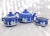 This is a Wedgwood Jasperware Teapot that is cream color on Portland Blue with the matching covered sugar bowl and...