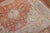 An early 20th century Turkish Oushak with a traditional medallion and border motif on an orange peel colored ground. The...