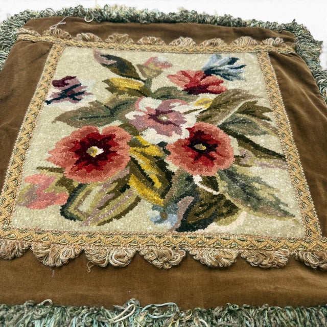 A charming decorative cushion cover featuring a Savonnerie-style floral rug panel set within a rich brown velvet surround...
