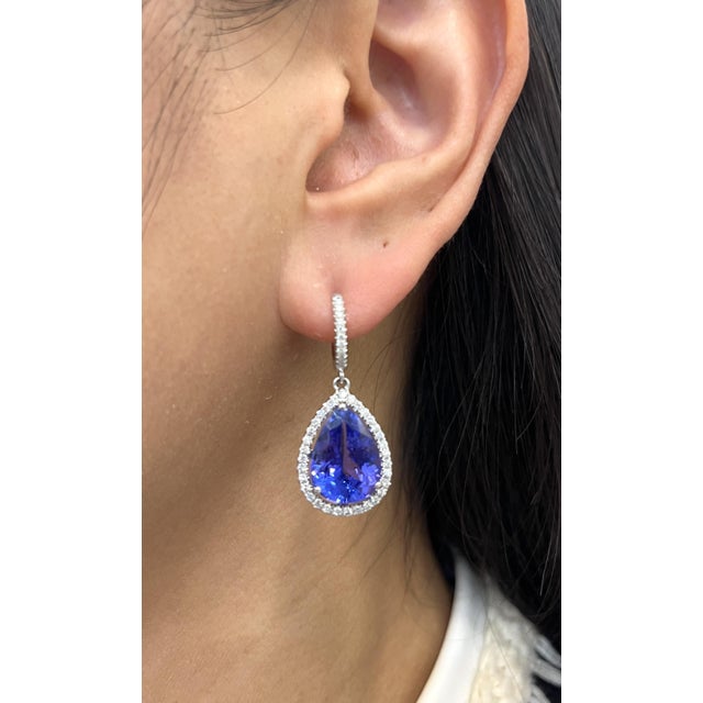 These breathtaking earrings feature 12.65 carats of natural tanzanite, radiating a rich and captivating blue-violet hue....