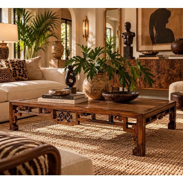 Magnificent Antique Chinese rectangular coffee table featuring an intricately carved wooden frame with a beautifully woven...