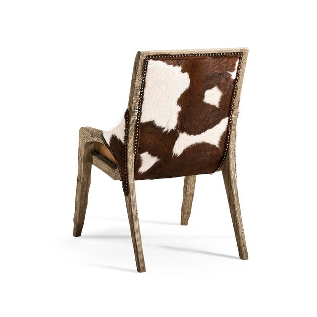 The Side Chair blends classic craftsmanship with a relaxed, refined style. The warm, distressed brown leather has a rich...