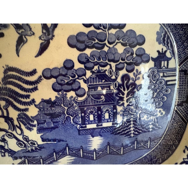 A 19th C English Staffordshire blue and white transfer ware serving platter. it is in the iconic Chinoiserie "Willow"...