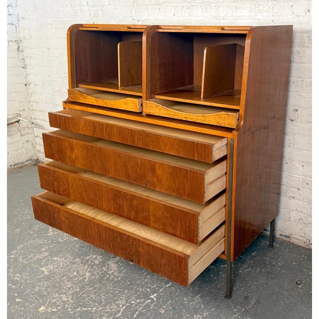Unique mid-century modern case piece with roll top storage. This unusual Gentleman's chest has ample storage with four...