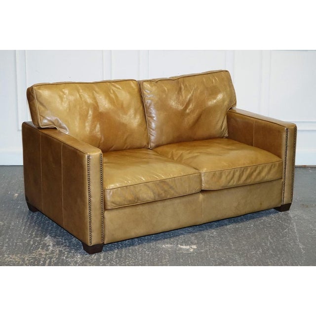 We are delighted to offer for sale this Lovely Timothy Oulton Viscount Tan Two Seater Leather Sofa. A very well made and...