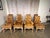 A set of eight French Louis XV-style leather tufted dining chairs, comprising six side chairs and two armchairs, embodying...