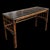 Vintage burnt bamboo console table featuring an inset glass top above an intricate open lattice bamboo surface. Crafted...