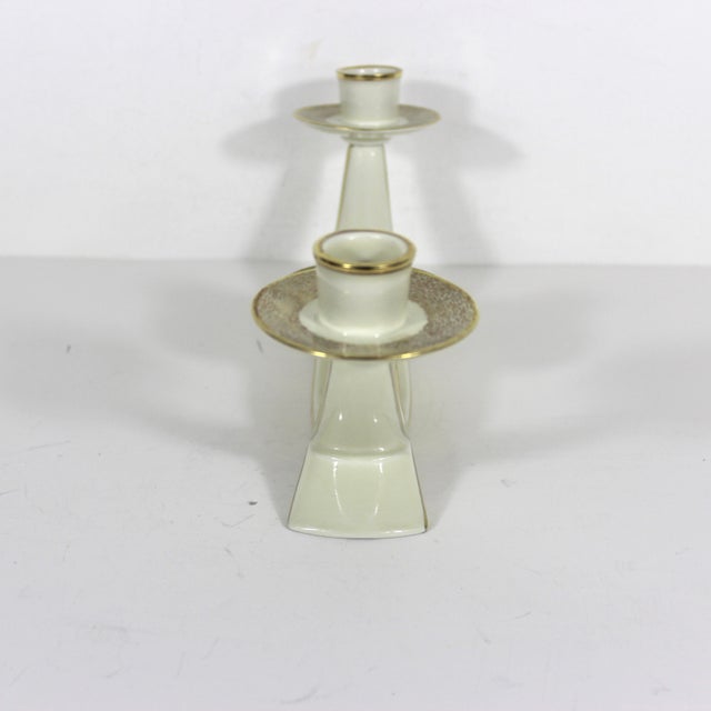 Mid century modern ceramic three arm candelabra in a cream colour with gold accents. This is in excellent condition with...