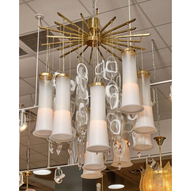 Vintage Italian chandelier from the Iconic Mazzega factory on the island of Murano. Twelve bell like glass elements hang...