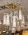 Vintage Italian chandelier from the Iconic Mazzega factory on the island of Murano. Twelve bell like glass elements hang...