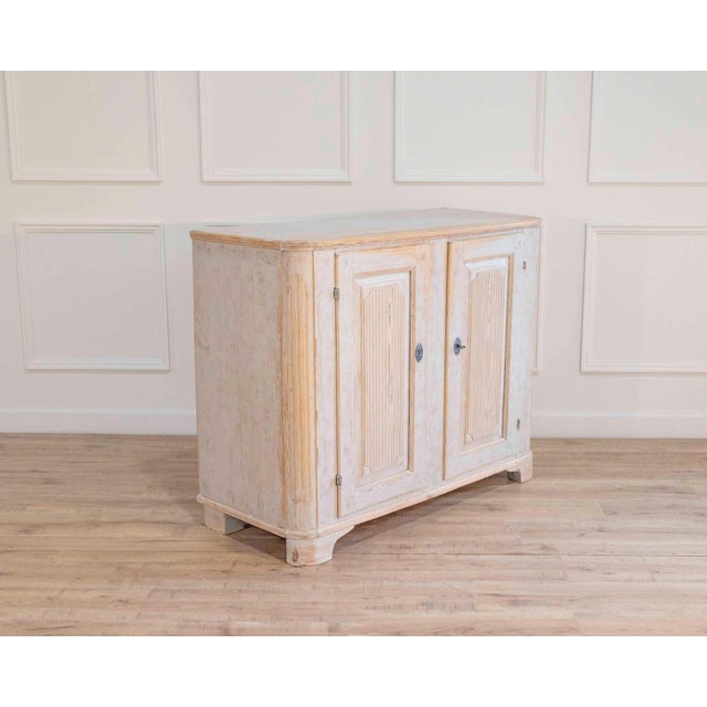 This period Gustavian two-door buffet dates to circa 1800 and is a refined example of early 19th-century Swedish case...