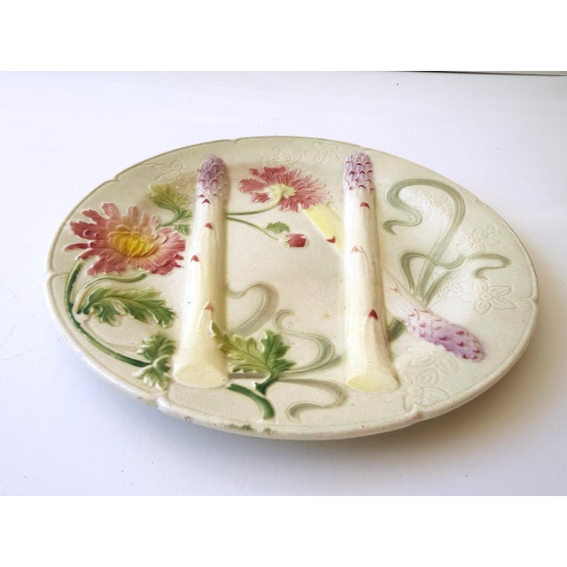 Beautiful antique French K&G St. Clément asparagus plate, circa late 19th/early 20th century. Creamy white ground with...