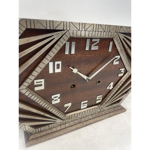 Beautiful Art Deco clock from the 1930s. Made of metal with a brass mechanism. Excellent decorative item.