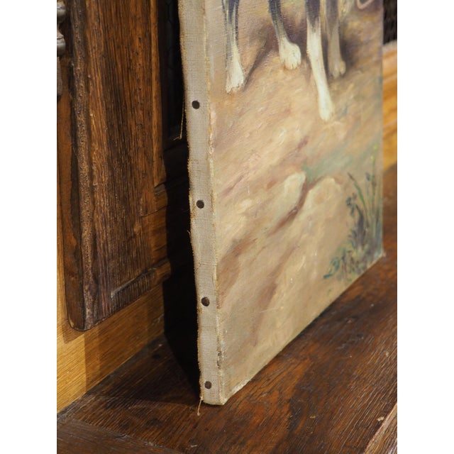 Dating to the 1800s, this French oil on canvas painting depicts a black and white working dog, possibly a Landseer, which...