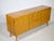 Mid-century modern sideboard by Möbel Mann from the 1960s. Finished in cherry wood on the exterior and light maple on the...