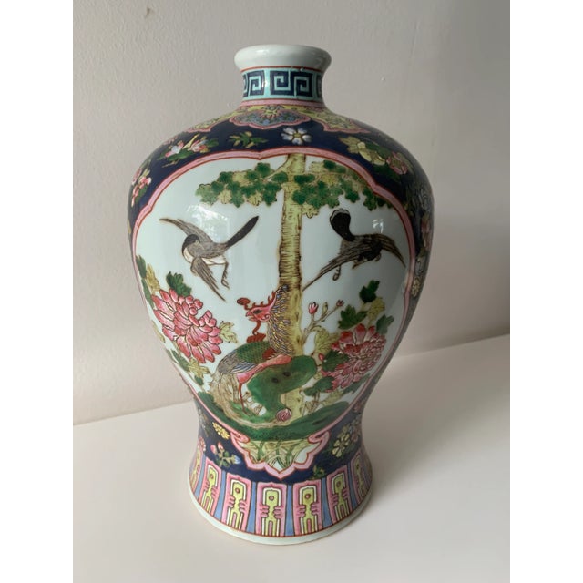 Great ginger jar shape, with blue, pink, white, green and yellow colors. Greek key pattern at top and abstract chinoiserie...