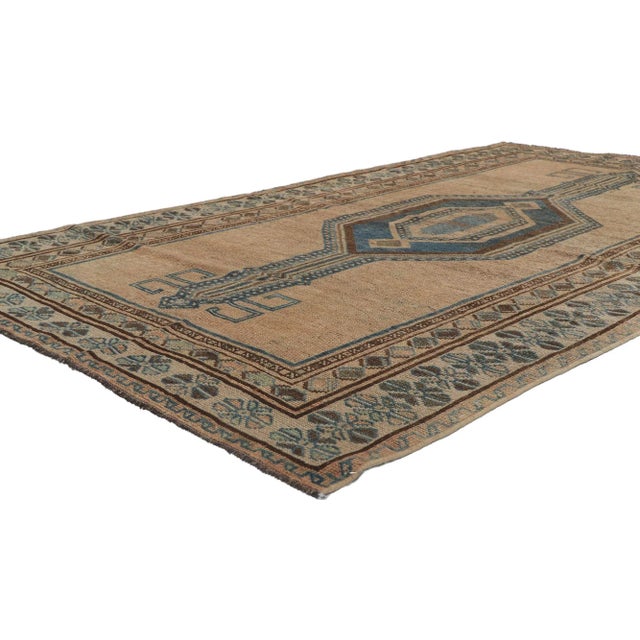 blue and brown antique northwest Persian rug runner 04'11 x 08'06. Warm and inviting, this hand knotted wool antique...