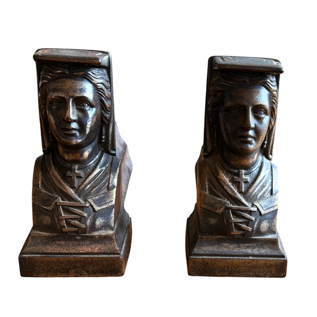 This striking pair of antique cast iron chenets (firedogs / andirons) features finely cast busts of women in stylized...