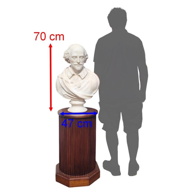 Impressive white marble bust on a pedestal base, depicting Shakespeare: the English poet is dressed in a doublet typical...