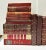 A curated set of vintage burgundy decorative books, ideal for creating a rich, layered library aesthetic. The varied tones...