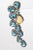 A fabulous pair of faceted, pear-shaped blue topaz gemstones bordered in pave`-set diamonds and featuring one pear-shaped...