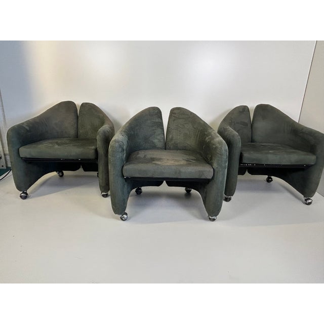 Eugenio Gerli Five armchairs, model Pd 142. Metal frame and Alcantara upholstery. Plastic wheels. Original label. Produced...