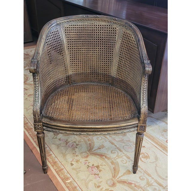 A striking and very beautiful with elegant lines is this Louie the 15th French cane Bergere arm chair. Features caning all...