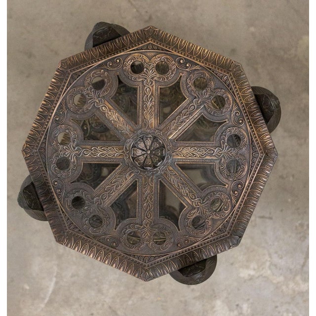 Bronze Etagère, 1920s/30s Featuring three perforated and decorated shelves, the legs end in lion's paws and are decorated...