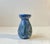 Small early 1920s vase decorated in blue and green glazes. Made at Møller & Bøgely in Denmark between 1918-25....