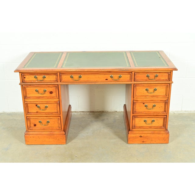 A gorgeous Georgian or Chippendale style executive desk By Sligh Furniture USA, Circa 1960s Carved solid pine, with...